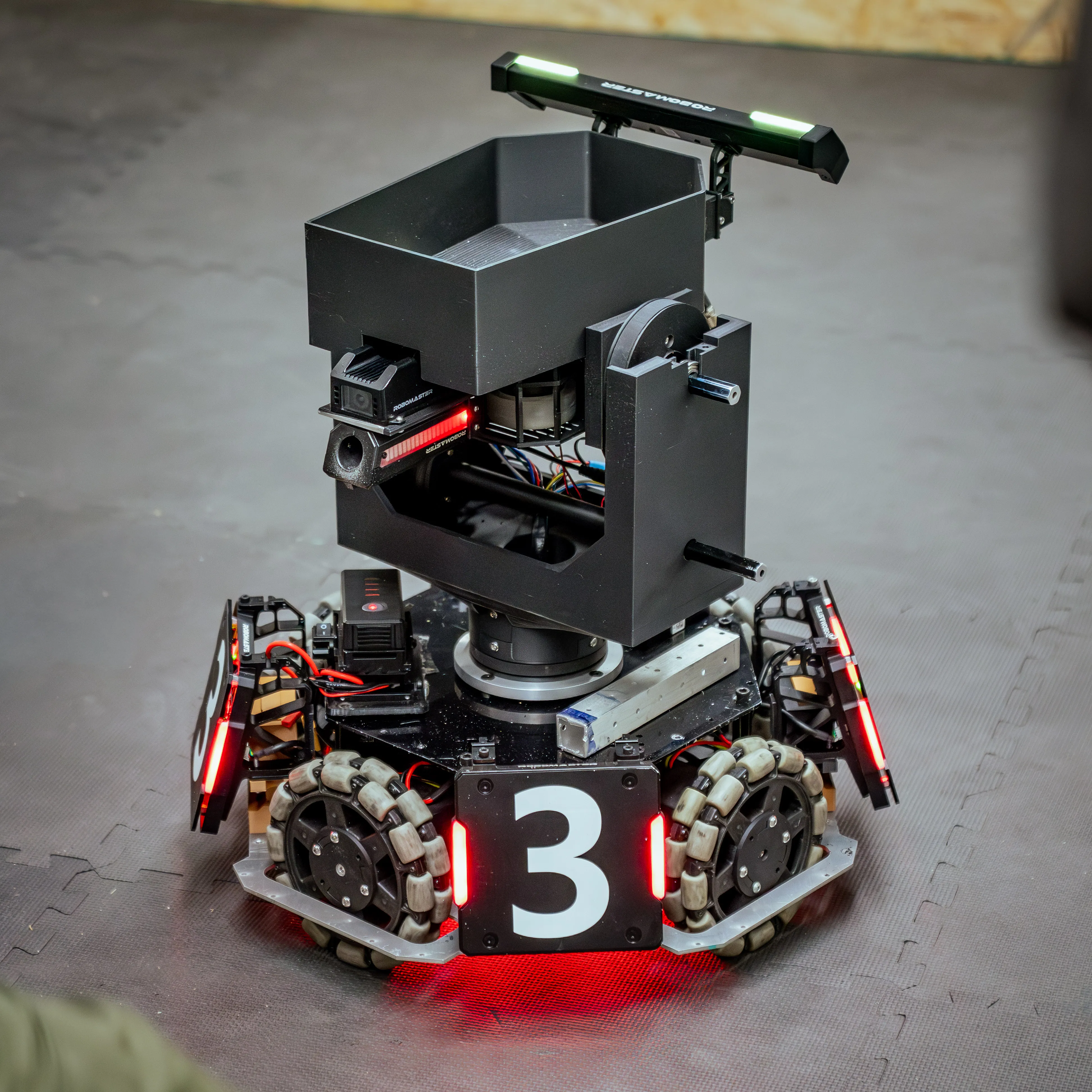 UTA RoboMasters Standard robot fully assembled under competition lighting